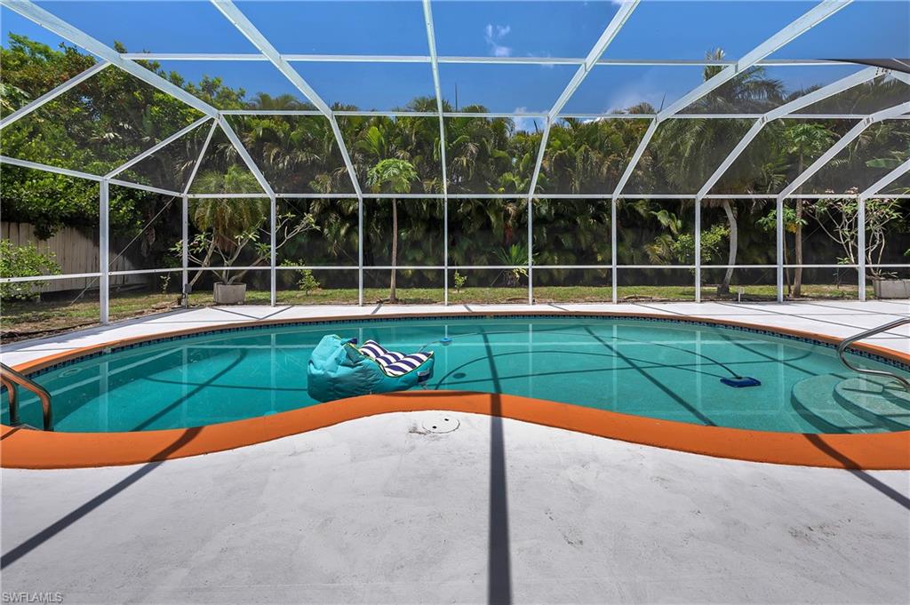 639 Pompano Drive Naples, FL 34110 - Photo 4 of 39 a view of a tennis court with a small play ground