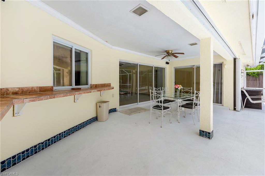 639 Pompano Drive Naples, FL 34110 - Photo 7 of 39 a view of a living room and natural light