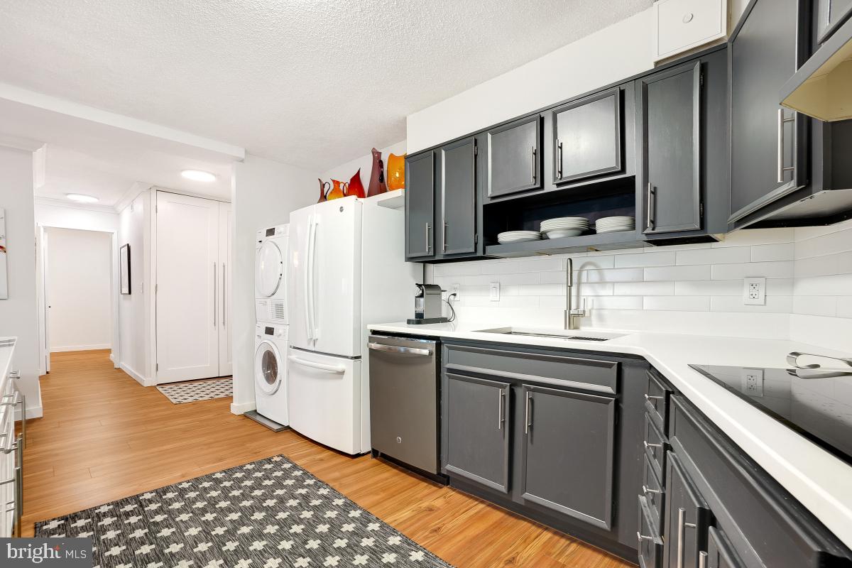 5901 Mt Eagle Drive, Unit 1604 Alexandria, VA 22303 - Photo 16 of 39 Kitchen- Quartz Countertops/Subway Tile Backsplash
