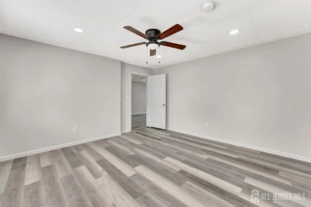 a view of room with window and ceiling fan