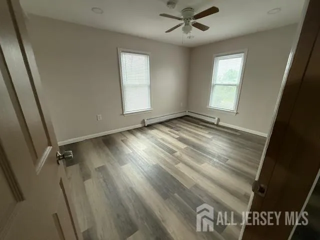 a view of an empty room and a window