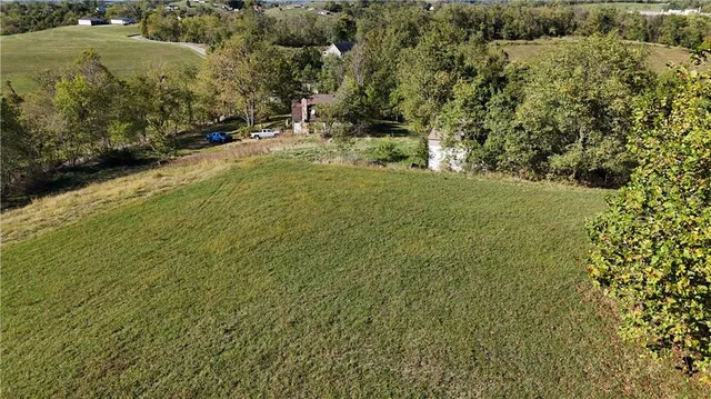a view of house with outdoor space and swimming pool