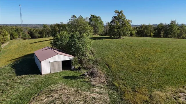 a aerial view of a house with a yard