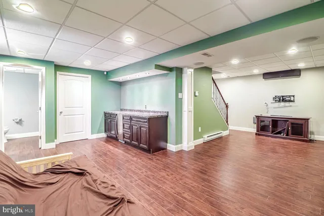 a view of a livingroom with furniture and an empty room