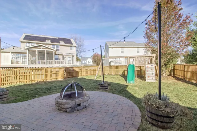 a view of a garden with lawn chairs