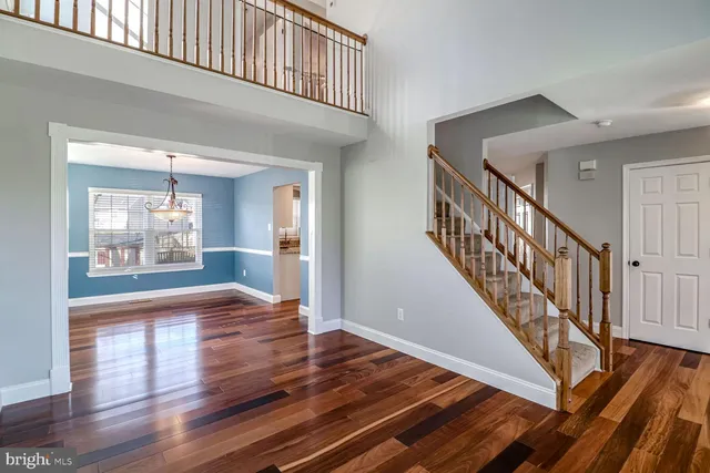 a view of an entryway with wooden floor