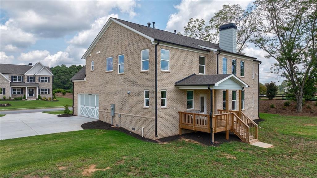 1025 Stonewood Field Road Watkinsville, GA 30677 - Photo 16 of 98 a view of a house with a yard and sitting area