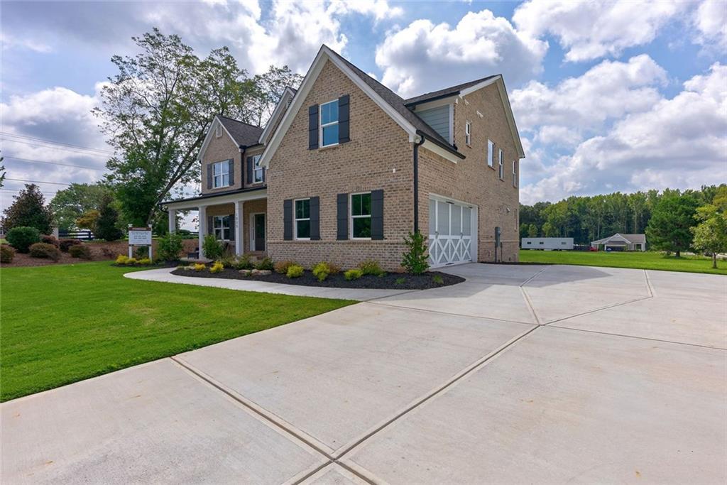 1025 Stonewood Field Road Watkinsville, GA 30677 - Photo 2 of 98 a front view of house with yard and green space