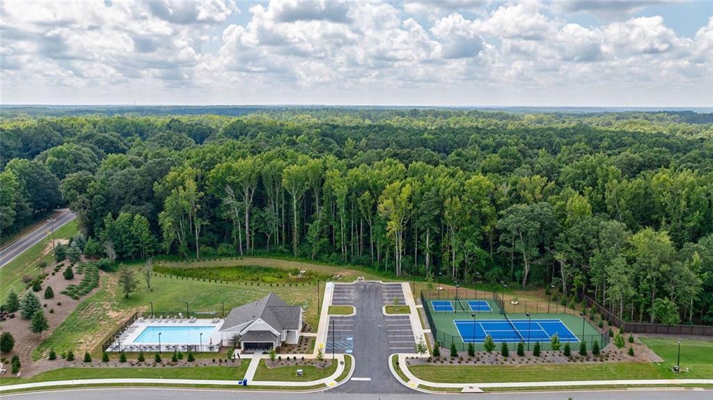 1025 Stonewood Field Road Watkinsville, GA 30677 - Photo 21 of 98 a view of a swimming pool with a yard