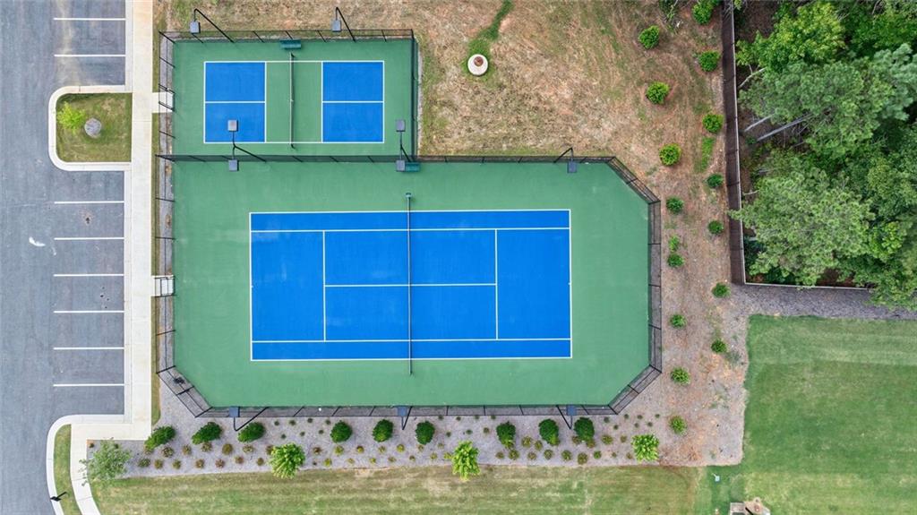 1025 Stonewood Field Road Watkinsville, GA 30677 - Photo 23 of 98 a front view of a house with a yard