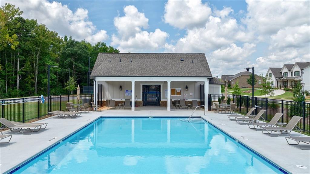 1025 Stonewood Field Road Watkinsville, GA 30677 - Photo 27 of 98 a view of house with swimming pool and sitting area