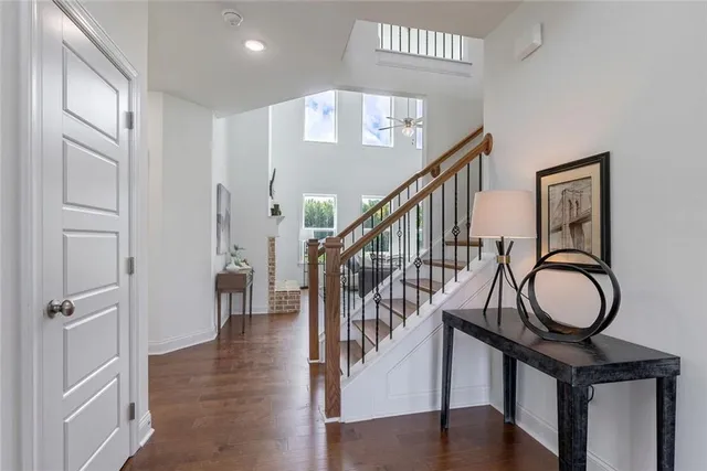 a spacious bedroom with a bed and a chandelier