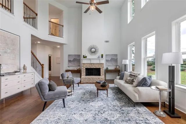 a bathroom with a sink toilet vanity and shower