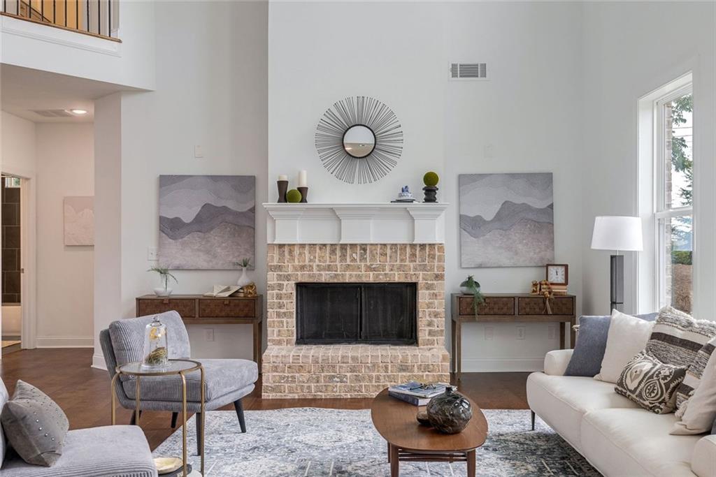 1025 Stonewood Field Road Watkinsville, GA 30677 - Photo 45 of 98 a living room with furniture and a fireplace