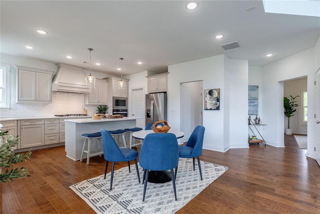 1025 Stonewood Field Road Watkinsville, GA 30677 - Photo 49 of 98 a view of kitchen with refrigerator dining table and chairs