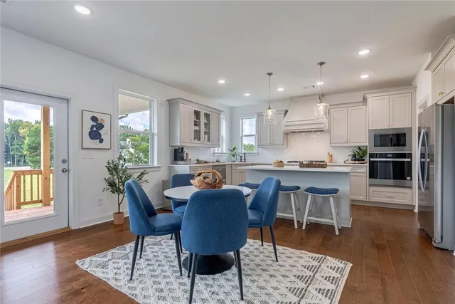 a front view of a house with a garden and yard