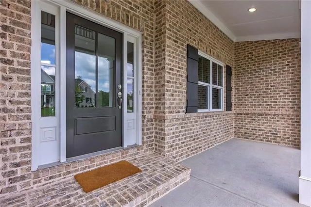 a front view of a house with swimming pool having outdoor seating