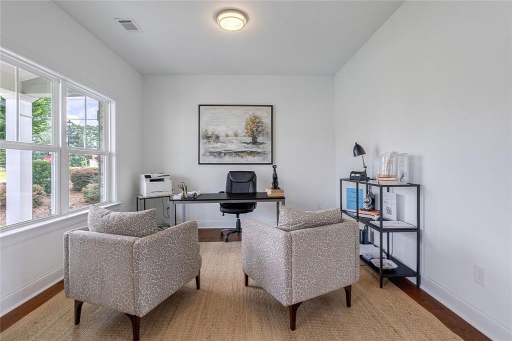 1025 Stonewood Field Road Watkinsville, GA 30677 - Photo 61 of 98 a living room with furniture and a window