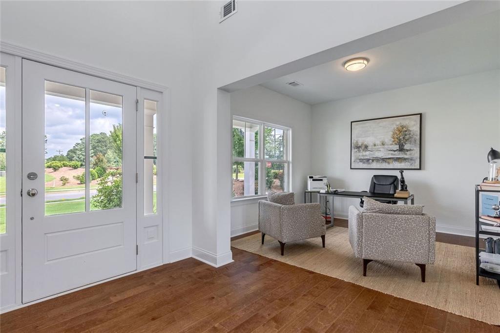 1025 Stonewood Field Road Watkinsville, GA 30677 - Photo 62 of 98 a living room with furniture and a window