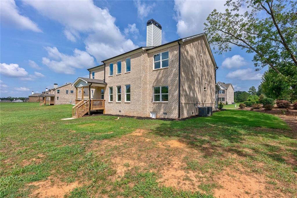 1025 Stonewood Field Road Watkinsville, GA 30677 - Photo 90 of 98 a view of a house with backyard and garden