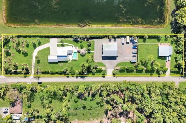 a view of a swimming pool and a yard