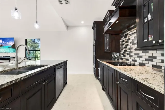 a kitchen with counter top space and sink
