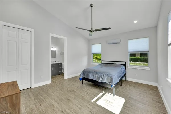 a living room with a bed furniture and a window