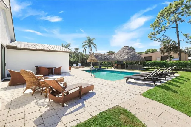 a view of a patio with a table and chairs