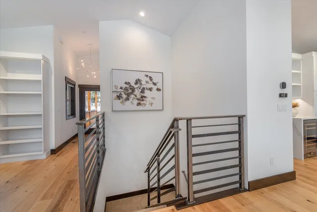 a bedroom with two beds and a flat screen tv