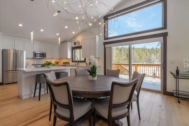 a kitchen with stainless steel appliances granite countertop sink microwave and wooden cabinets