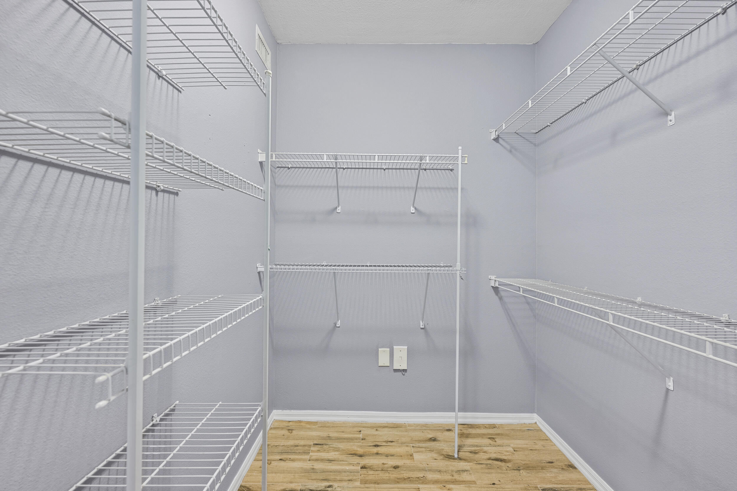 6410 Emerald Dunes Drive, Unit 101 West Palm Beach, FL 33411 - Photo 21 of 39 a view of walk in closet