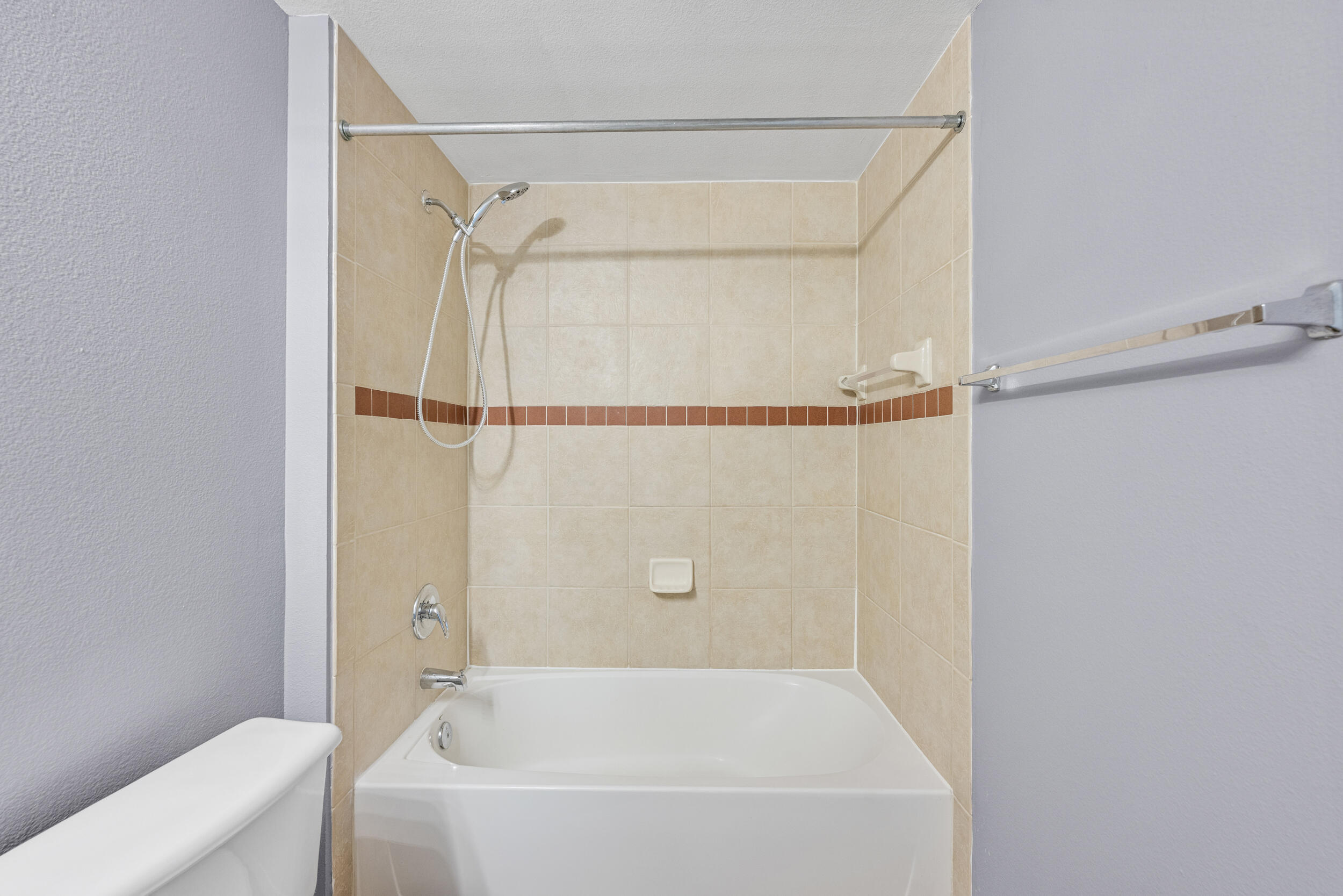 6410 Emerald Dunes Drive, Unit 101 West Palm Beach, FL 33411 - Photo 23 of 39 a bathroom with a bathtub and a shower