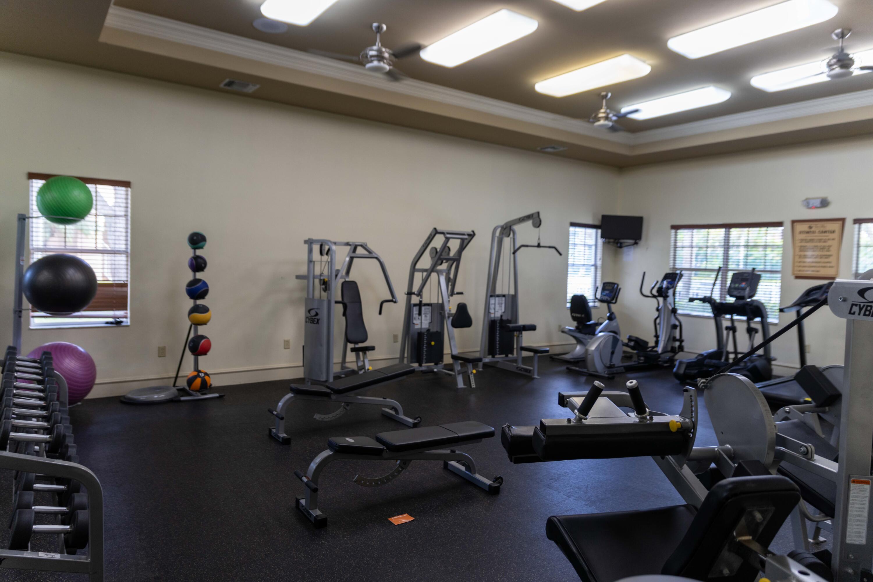 6410 Emerald Dunes Drive, Unit 101 West Palm Beach, FL 33411 - Photo 30 of 39 a view of a room with gym equipment