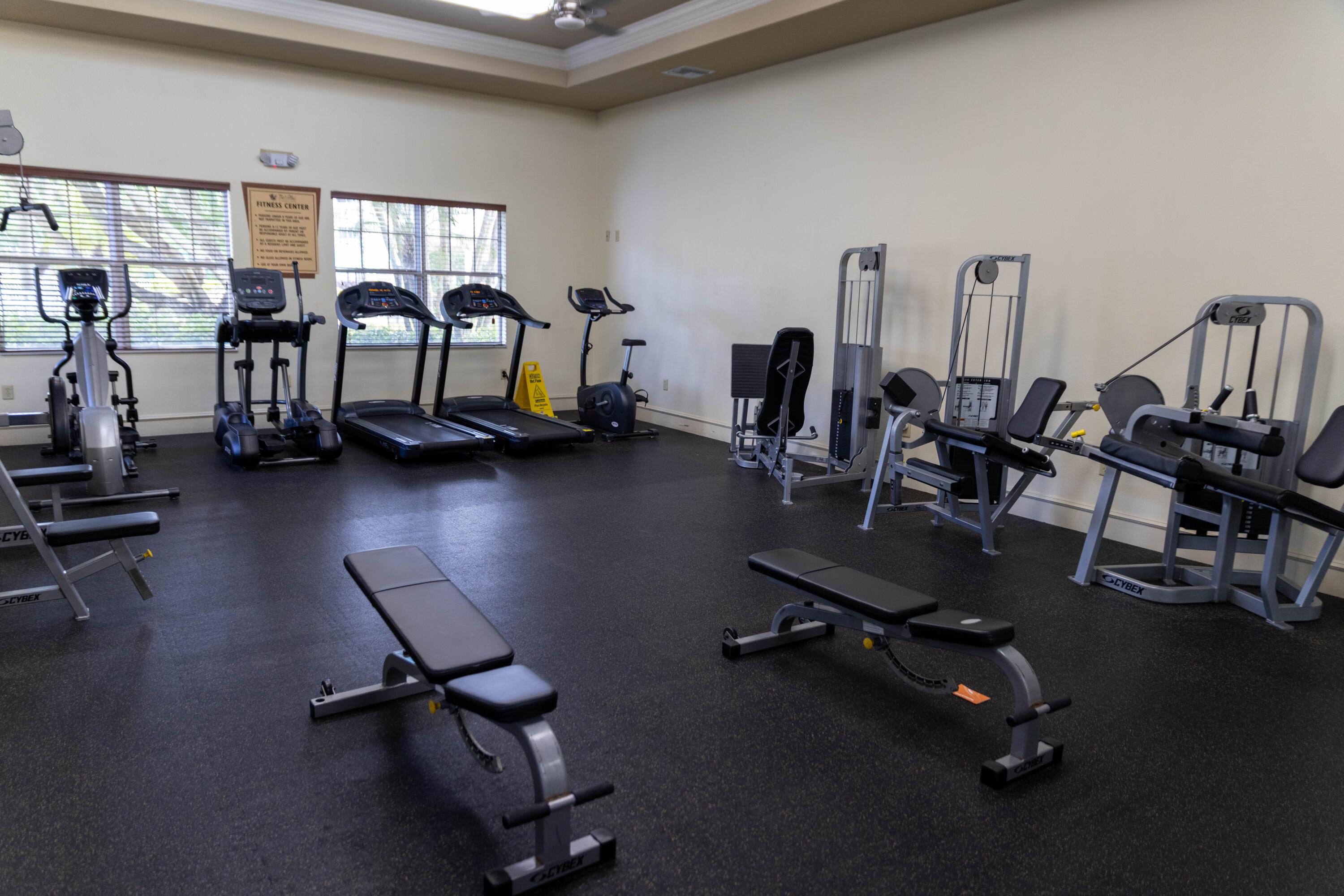 6410 Emerald Dunes Drive, Unit 101 West Palm Beach, FL 33411 - Photo 31 of 39 a view of a room with gym equipment