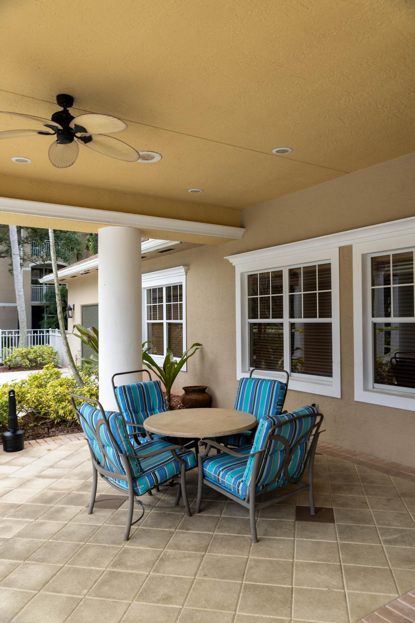6410 Emerald Dunes Drive, Unit 101 West Palm Beach, FL 33411 - Photo 37 of 39 a outdoor living space with furniture and a window