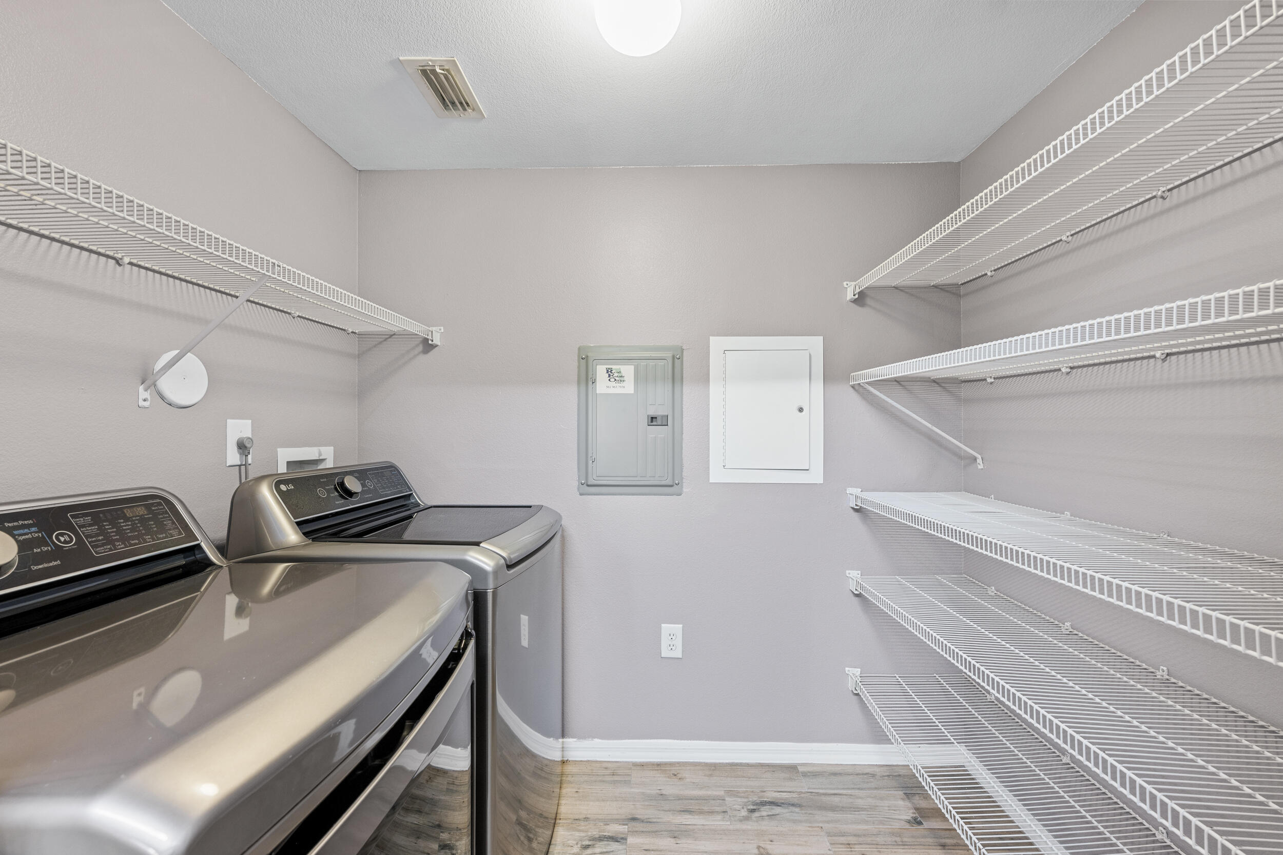 6410 Emerald Dunes Drive, Unit 101 West Palm Beach, FL 33411 - Photo 9 of 39 a view of a room with racks on the wall