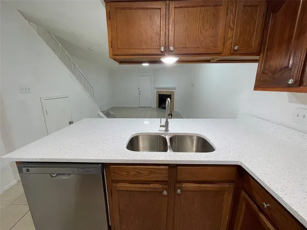 a kitchen with a sink and cabinets