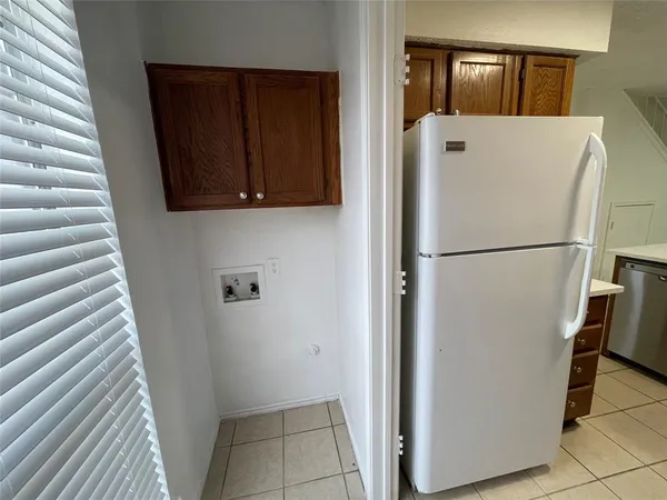 a white refrigerator freezer sitting in a kitchen