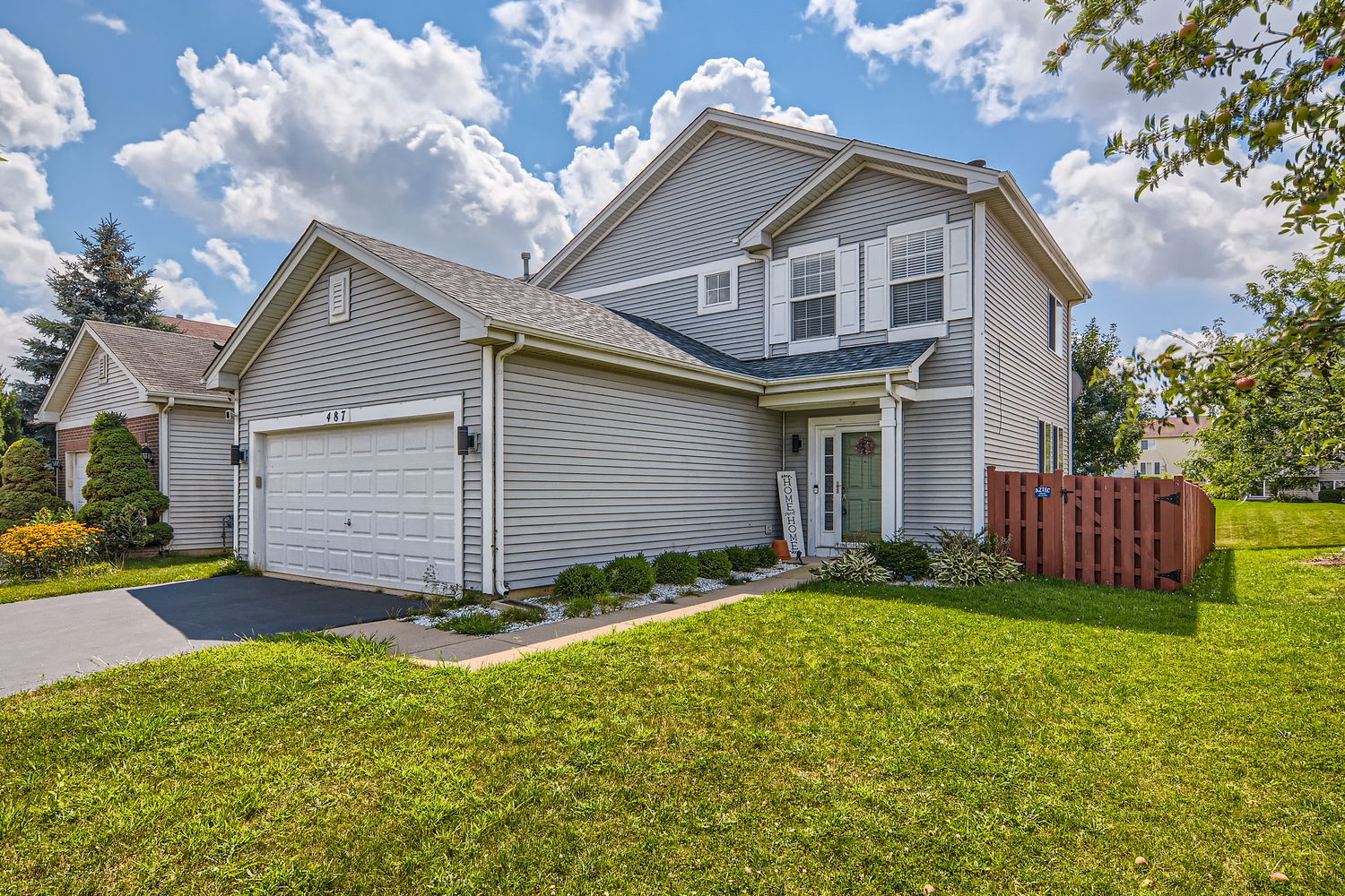 487 West Hamlin Lane Round Lake, IL 60073 - Photo 1 of 28 a view of a house with a yard and a large tree