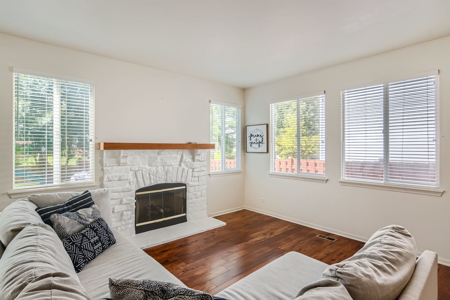 487 West Hamlin Lane Round Lake, IL 60073 - Photo 12 of 28 a bedroom with a bed and a couch
