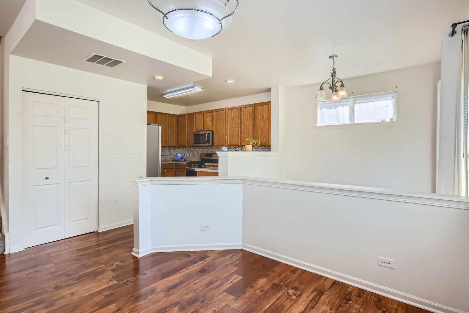 487 West Hamlin Lane Round Lake, IL 60073 - Photo 14 of 28 a kitchen with a refrigerator and a stove top oven