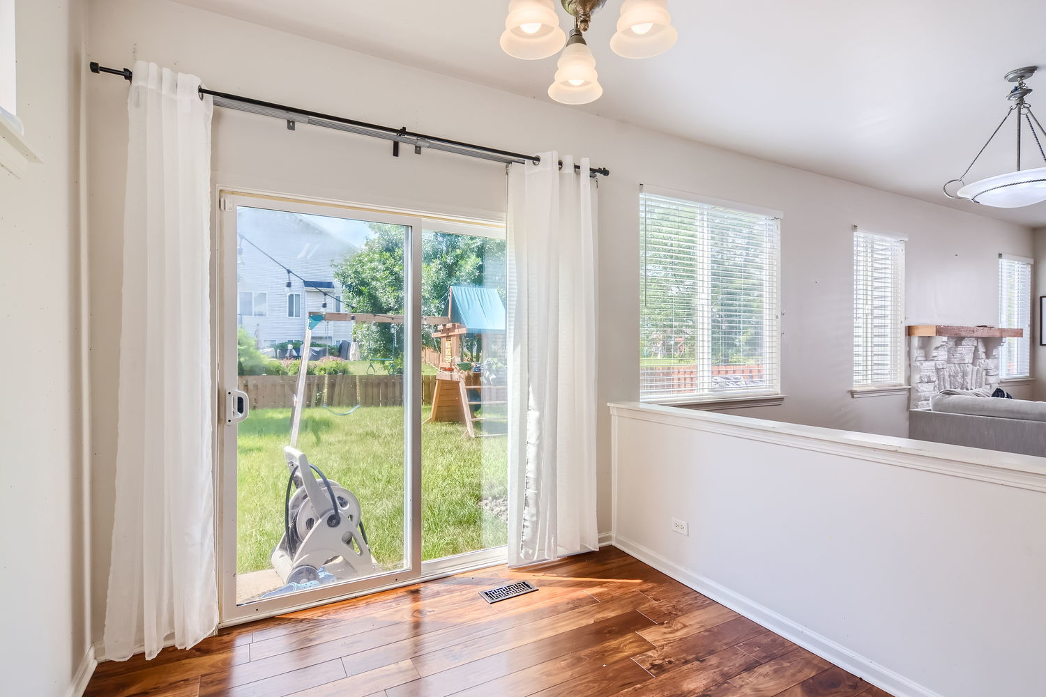 487 West Hamlin Lane Round Lake, IL 60073 - Photo 18 of 28 a view of an empty room with wooden floor and a window
