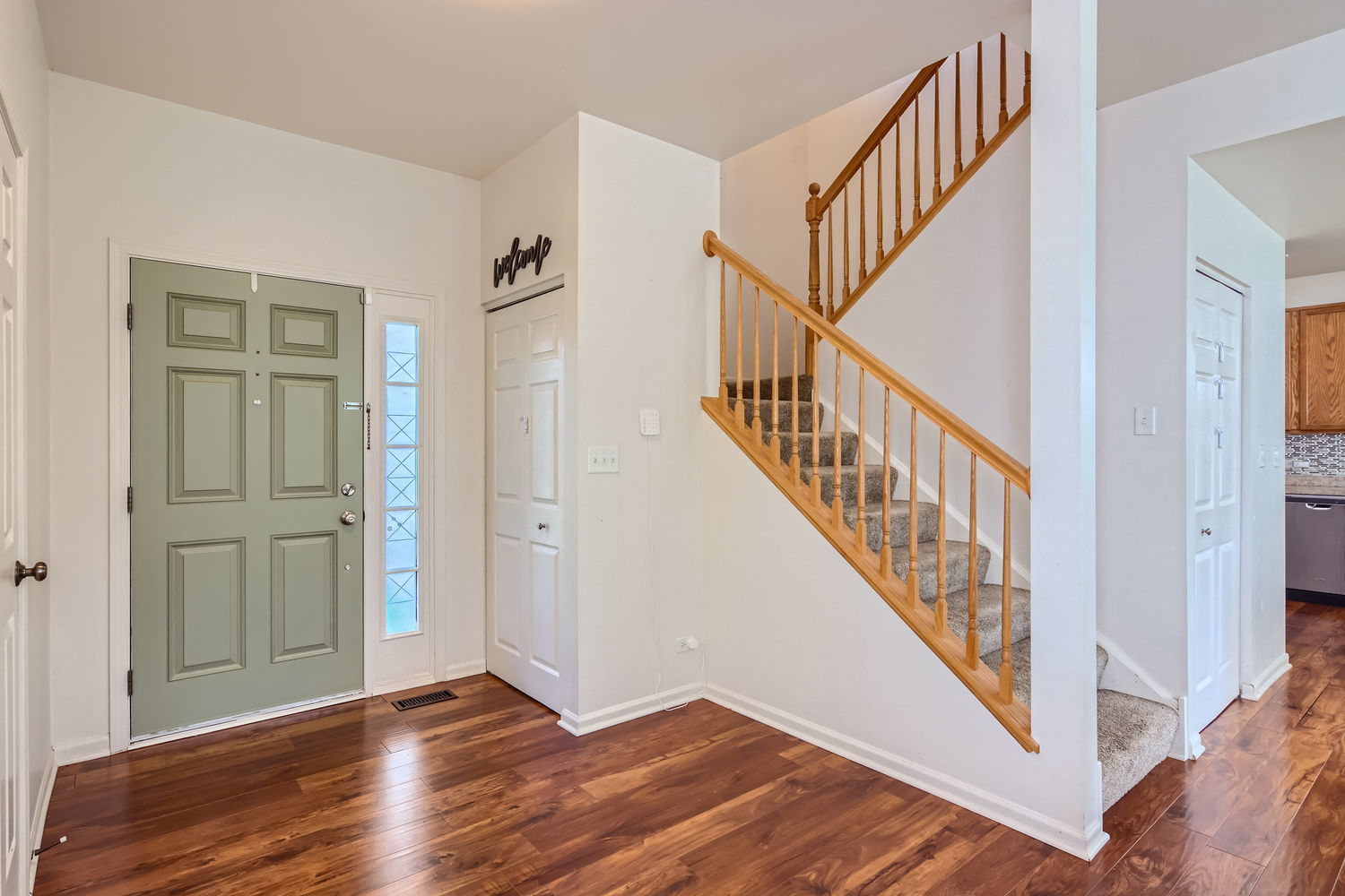 487 West Hamlin Lane Round Lake, IL 60073 - Photo 9 of 28 a view of an entryway with wooden floor
