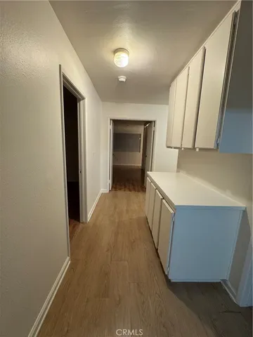 a hallway with washer and dryer