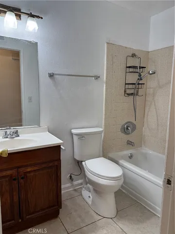 a bathroom with a sink a toilet and a bathtub