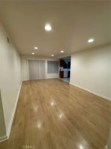 an empty room with wooden floor