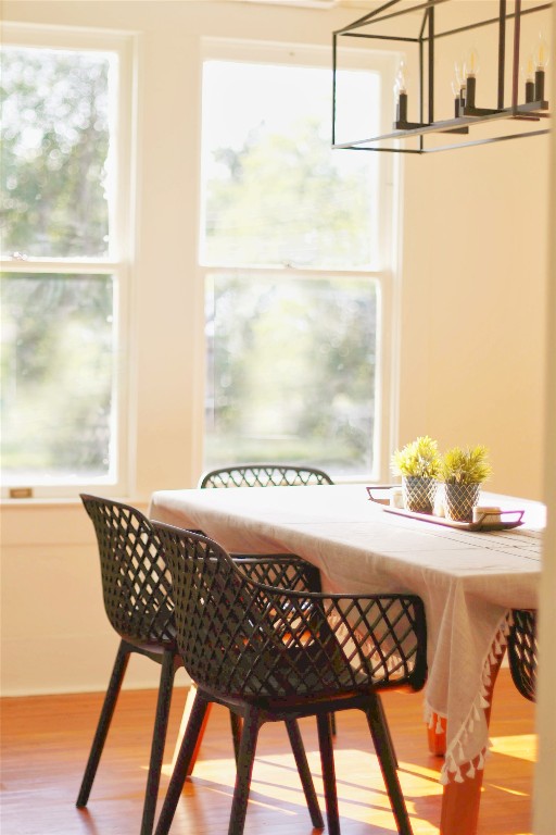 a view of a dining table chair and window