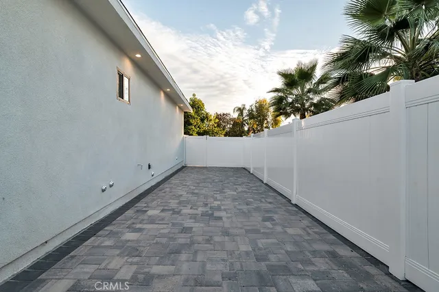 a view of backyard with ceiling fan