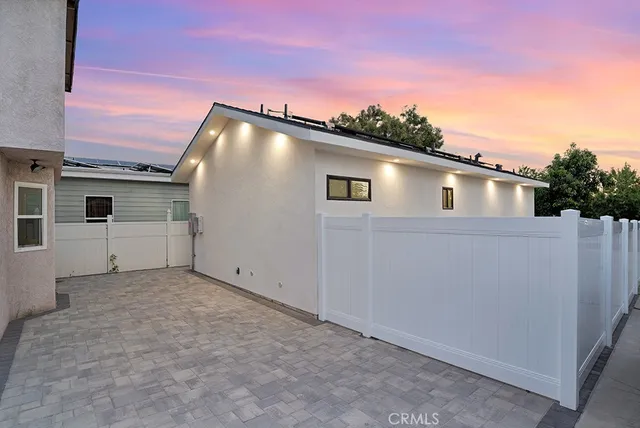 a view of a house with a road