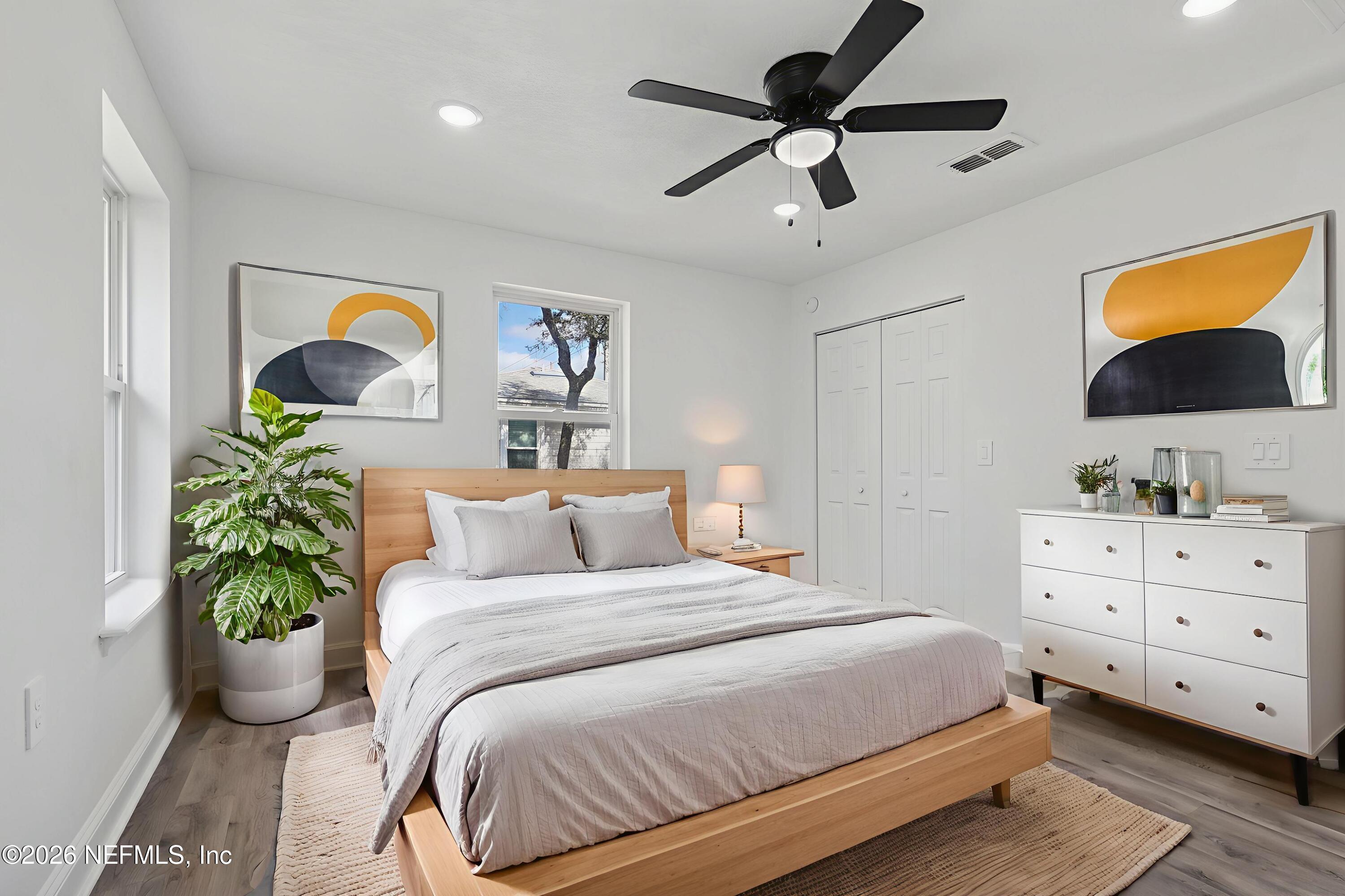 1022 Penman Road Jacksonville Beach, FL 32250 - Photo 12 of 52 a bedroom with a bed and a flat screen tv